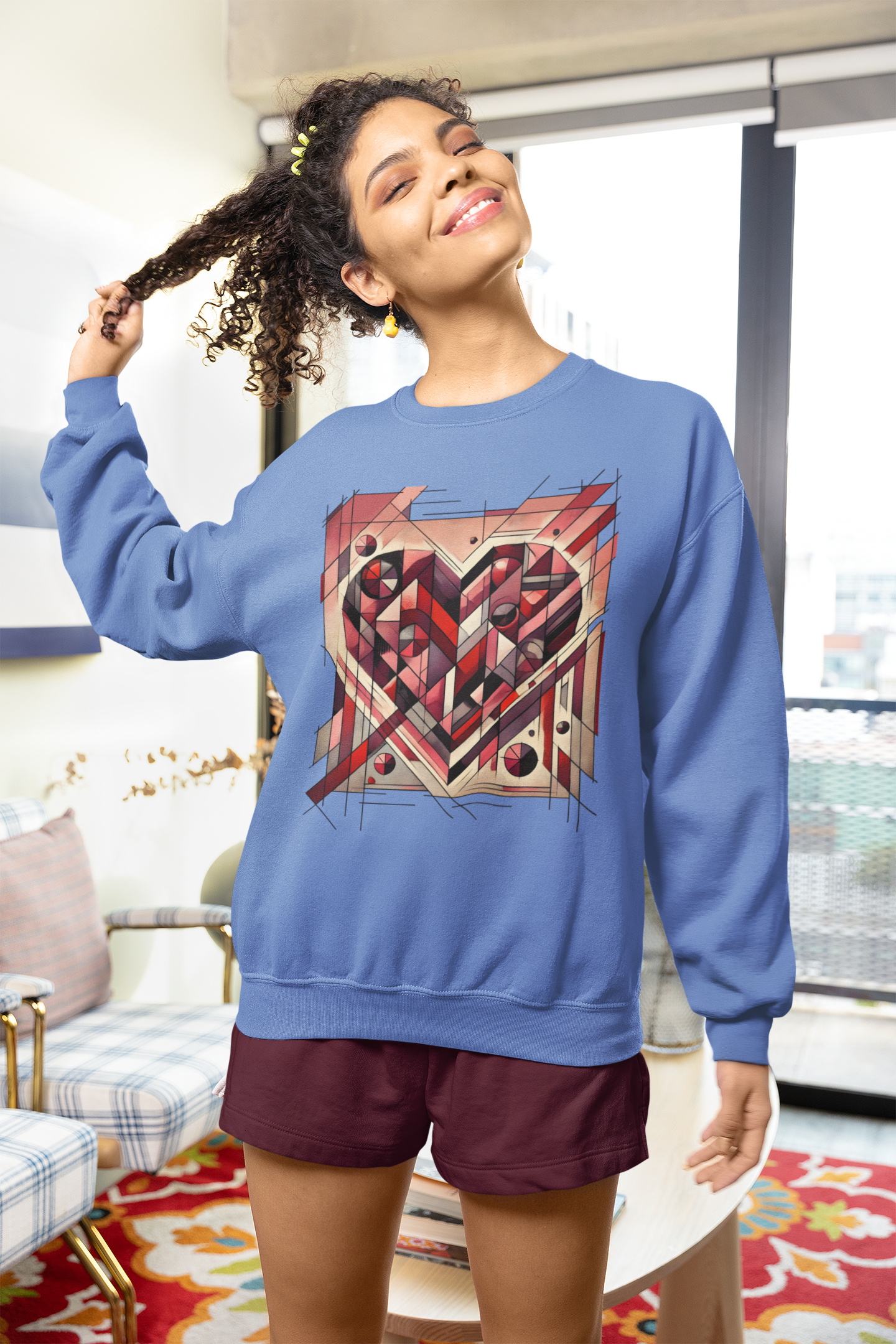 Cubist Heart Sweatshirt – Modern Art Valentine’s Day Pullover worn in a bright interior, highlighting the cubist heart design on a soft blue sweatshirt