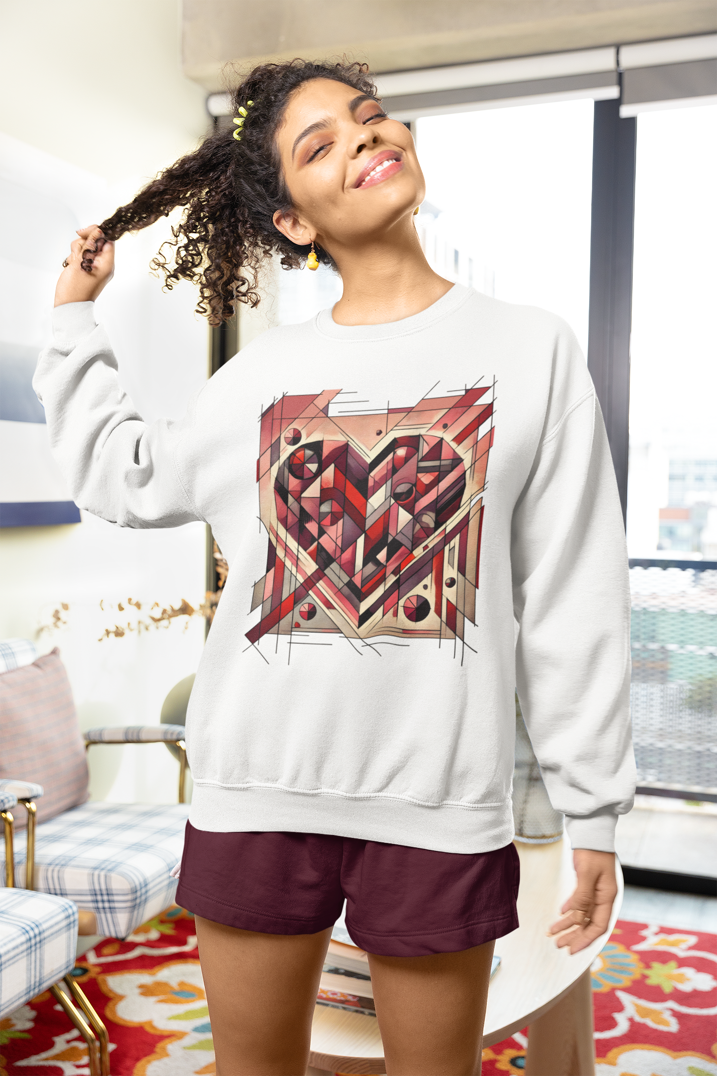 Cubist Heart Sweatshirt – Modern Art Valentine’s Day Pullover modeled indoors, showcasing the cubist heart artwork printed on a white sweatshirt