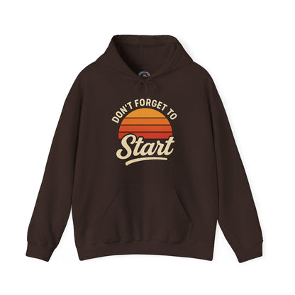 Don’t Forget to Start Hoodie – Retro Sunrise Motivational Sweatshirt in Dark Chocolate, showcasing the warm sunset palette on a deep brown background.
