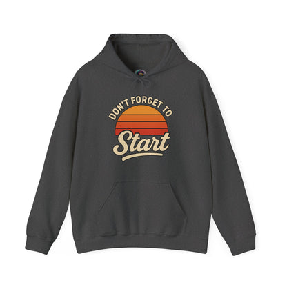 Don’t Forget to Start Hoodie – Retro Sunrise Motivational Sweatshirt shown in Dark Heather, highlighting the vintage sunrise graphic and relaxed unisex hoodie fit.