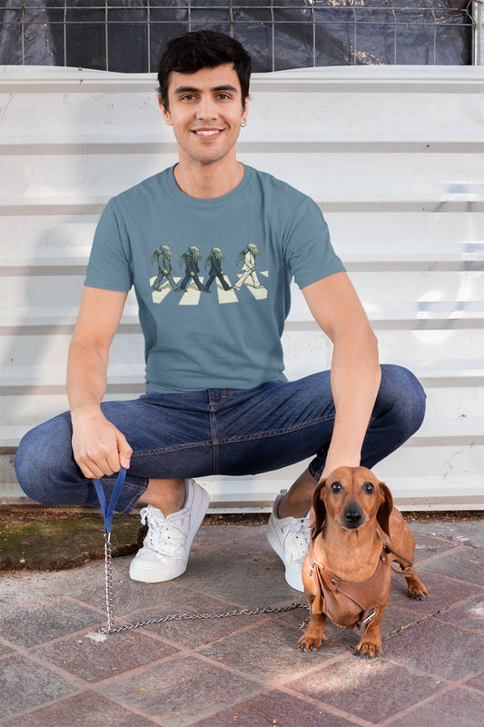 Abbey Road Shirt – Lifestyle
Cthulhu Crossing T-Shirt – Beatles Abbey Road Parody Tee in teal, modeled outdoors with dog, fun Cthulhu rocker parody shirt.