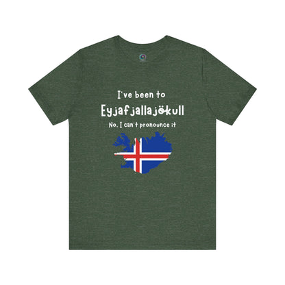 Eyjafjallajökull T-Shirt – Funny Iceland Volcano Travel Merch in deep heather forest green, featuring the Icelandic landmark name with iconic red, white, and blue flag.