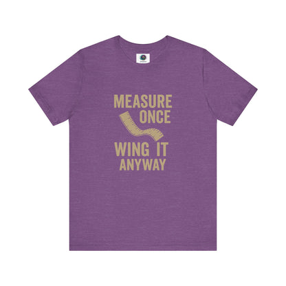 Measure Once Wing It Anyway T-Shirt in heather team purple, bringing creative energy and humor to maker culture.