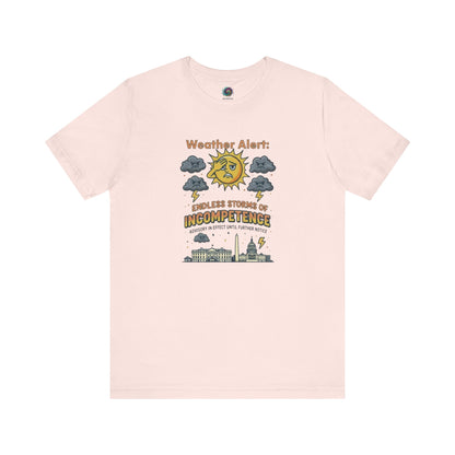 Weather Alert: Endless Storms of Incompetence Political Satire T-Shirt in soft pink. Graphic features moody clouds and lightning bolts over D.C. skyline.