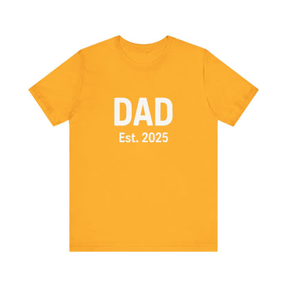 Dad Est. 2025 T-Shirt – New Dad Shirt, First Father’s Day Gift, Pregnancy Announcement Tee in gold flat lay, playful and bold
