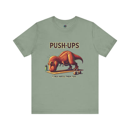 T-Rex Push-Up T-Shirt – Funny Dinosaur Workout Graphic Tee in sage green for workout t rex fans who love gym humor.