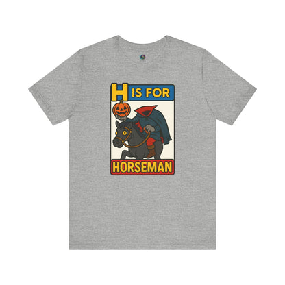 H is for Horseman T-Shirt – Headless Horseman Halloween Tee in grey, flat lay design with cartoon pumpkin-headed rider for Halloween horseman fans.