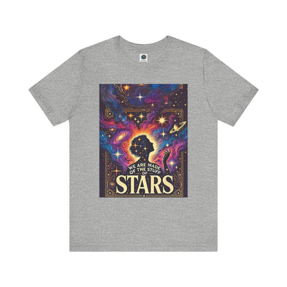 Grey flat-lay of cosmic clothing with colorful star-filled design and silhouette of a woman in space