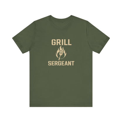 Grill Sergeant Shirt – Funny BBQ T-Shirt for Grill Lovers - Flat lay of military green Grill Sergeant barbecue shirt, bold grilling humor for Father’s Day or