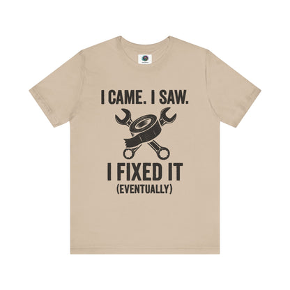 Funny Fix-It T-Shirt – "I Came, I Saw, I Fixed It... Eventually" DIY Repair Humor Tee in light tan, casual shirt for fixer-uppers.