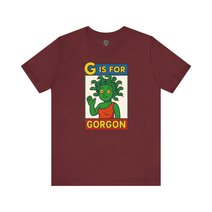 Heather cardinal G is for Gorgon tshirt, monster alphabet design with cheerful gorgon head graphic for Halloween.