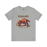 T-Rex Push-Up T-Shirt – Funny Dinosaur Workout Graphic Tee in athletic heather gray, designed for t rex hates push ups lovers and gym rats alike.