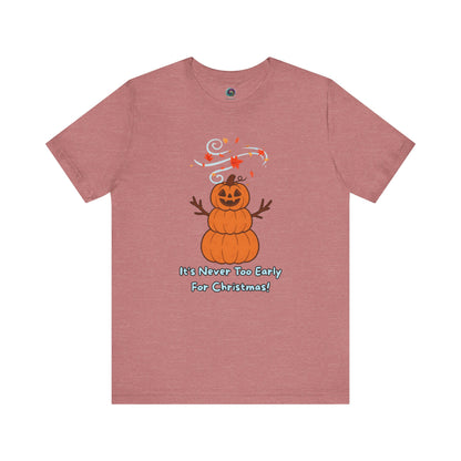 Pumpkin Snowman T-Shirt – It’s Never Too Early for Christmas in heather mauve, fun pumpkin Christmas tee blending Halloween and holiday spirit.