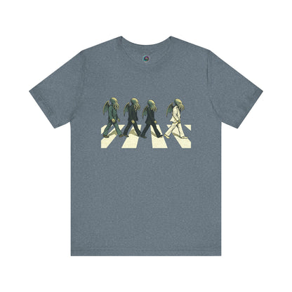 Cthulhu Crossing T-Shirt – Beatles Abbey Road Parody Tee in heather slate, flat lay parody tee with Cthulhu rocker mashup.