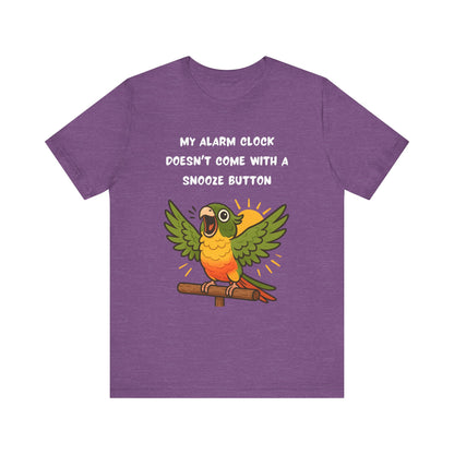 Parrot Alarm Clock T-Shirt – Funny Parrot Wake-Up Call Tee in Heather Team Purple, featuring the lively shouting parrot graphic and the bright wake-up call message printed prominently on the shirt.