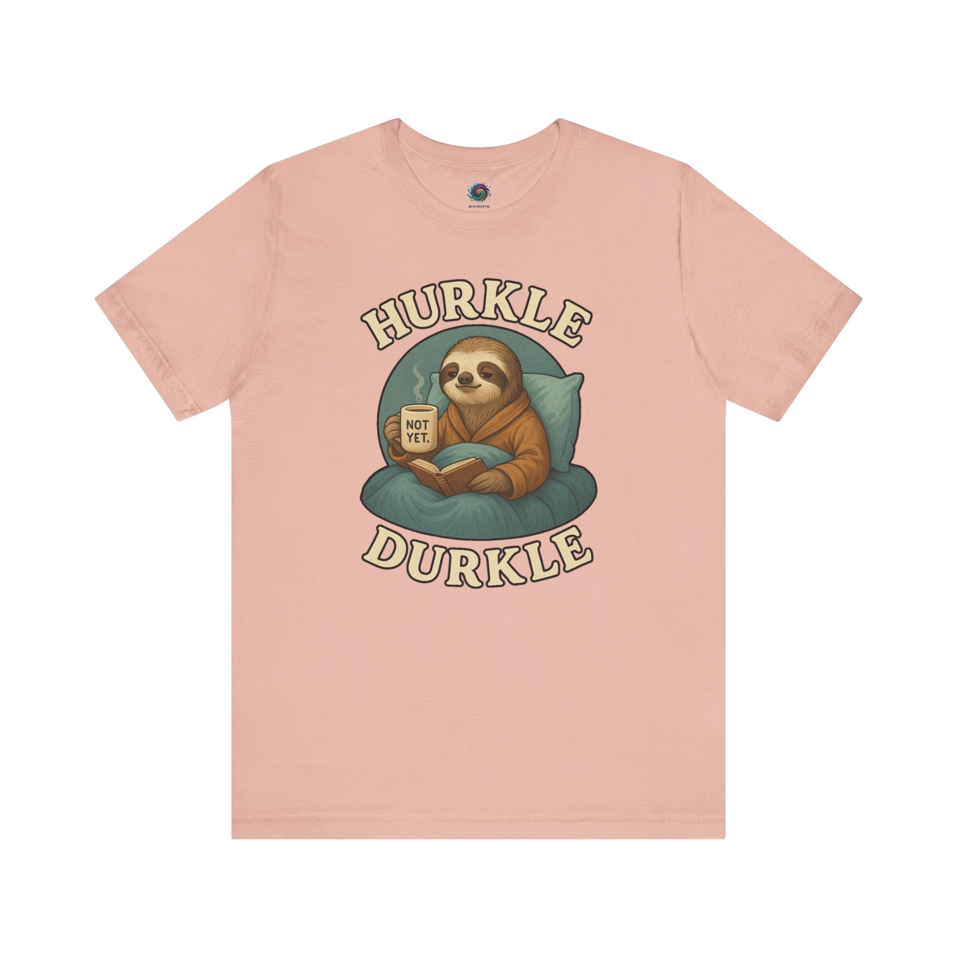 Hurkle Durkle Sloth T-Shirt – Cozy Sloth Shirt for Lazy Days laid flat in soft Peach color, emphasizing cozy design and relaxed tone