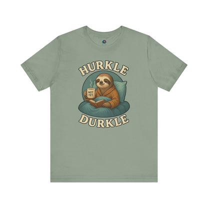 Hurkle Durkle Sloth T-Shirt – Cozy Sloth Shirt for Lazy Days in Sage color laid flat to show whimsical sloth enjoying downtime