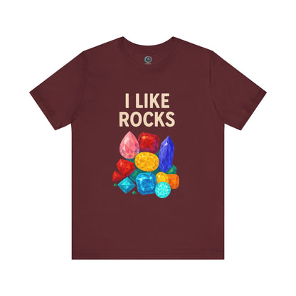 Flat lay of maroon I Like Rocks Shirt with bright gem graphics, designed for rock lovers and mineral enthusiasts.