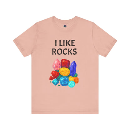 Flat lay of peach I Like Rocks Shirt with bold gem cluster print, ideal for quirky geology-themed outfits.