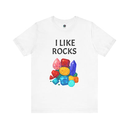 Flat lay of white I Like Rocks Shirt with bright multi-gem cluster – fun choice for anyone who proudly says i like rocks.