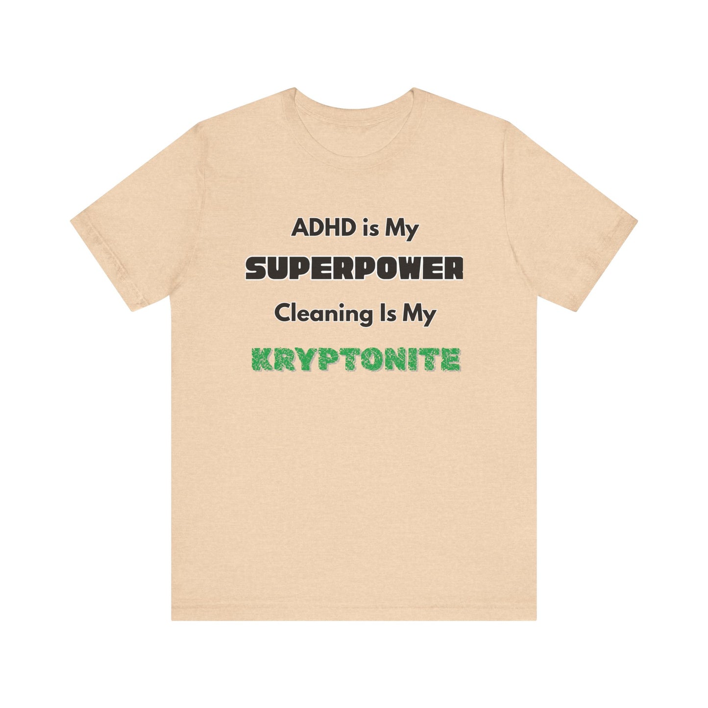 ADHD Cleaning Kryptonite T-Shirt – Funny Shirt for Neurodivergent Humor in heather sand dune with green kryptonite lettering