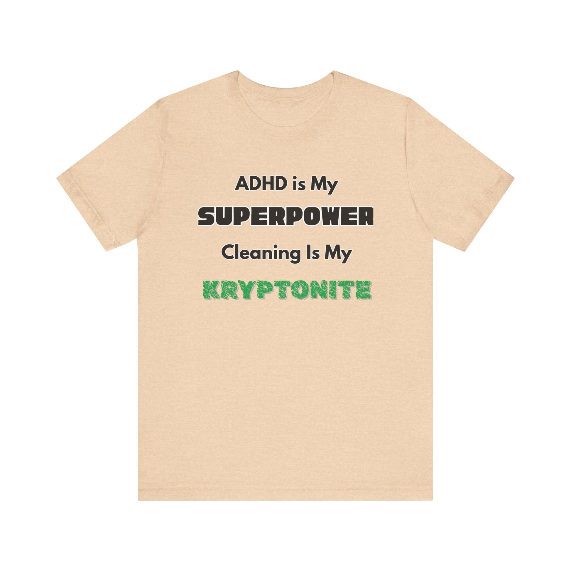 ADHD Cleaning Kryptonite T-Shirt – Funny Shirt for Neurodivergent Humor in heather sand dune with green kryptonite lettering
