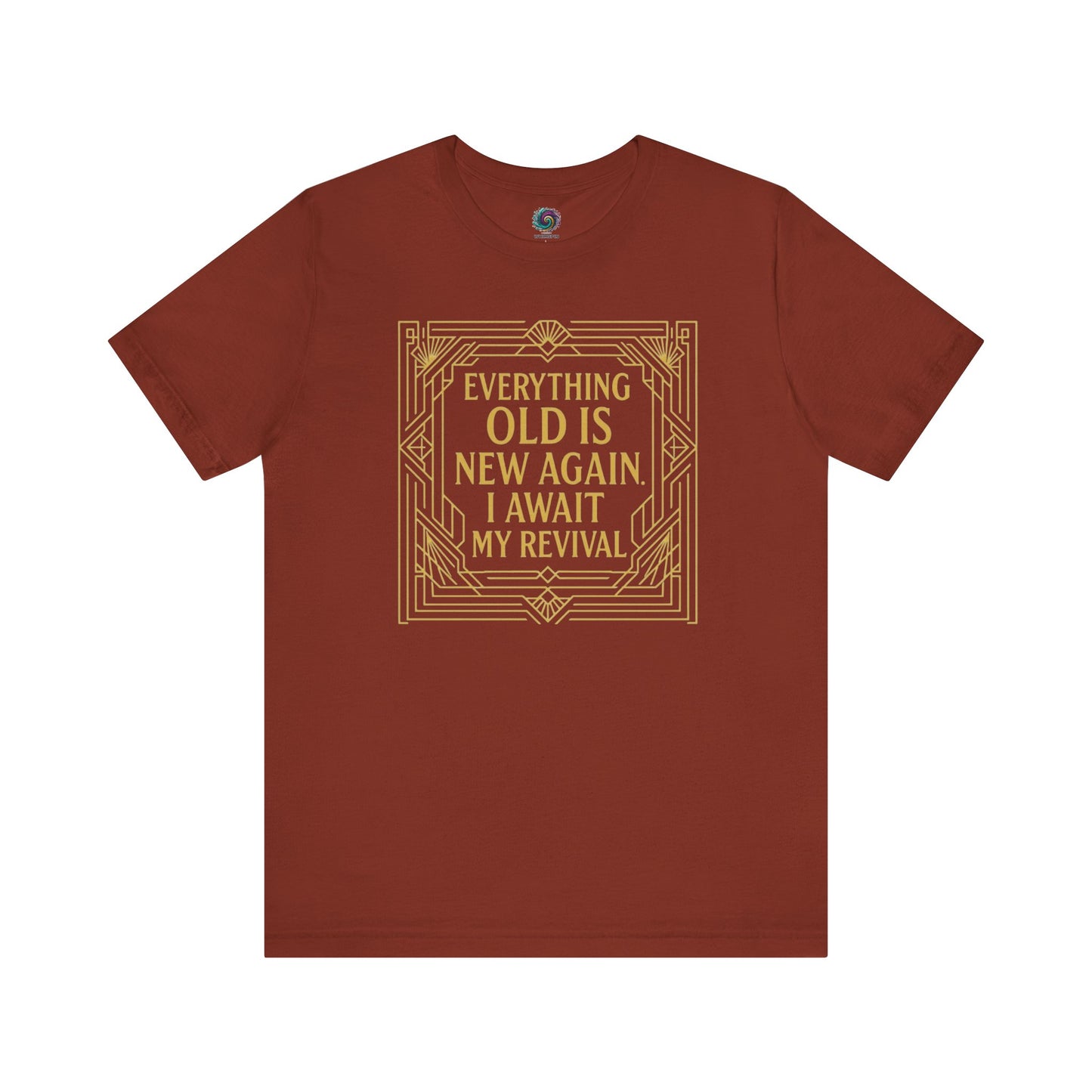 Rust-colored tee with gold Art Nouveau frame and witty phrase about revival and aging—Everything Old Is New Again.