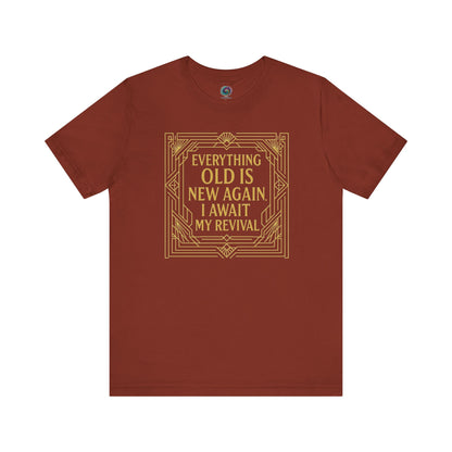 Rust-colored tee with gold Art Nouveau frame and witty phrase about revival and aging—Everything Old Is New Again.