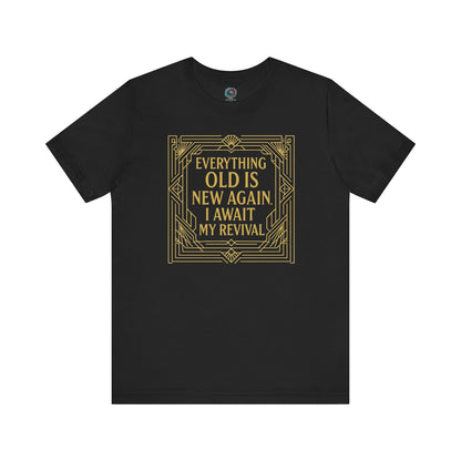 Black t-shirt with gold decorative frame reading Everything Old Is New Again – I Await My Revival, blending self-deprecating humor and vintage style.