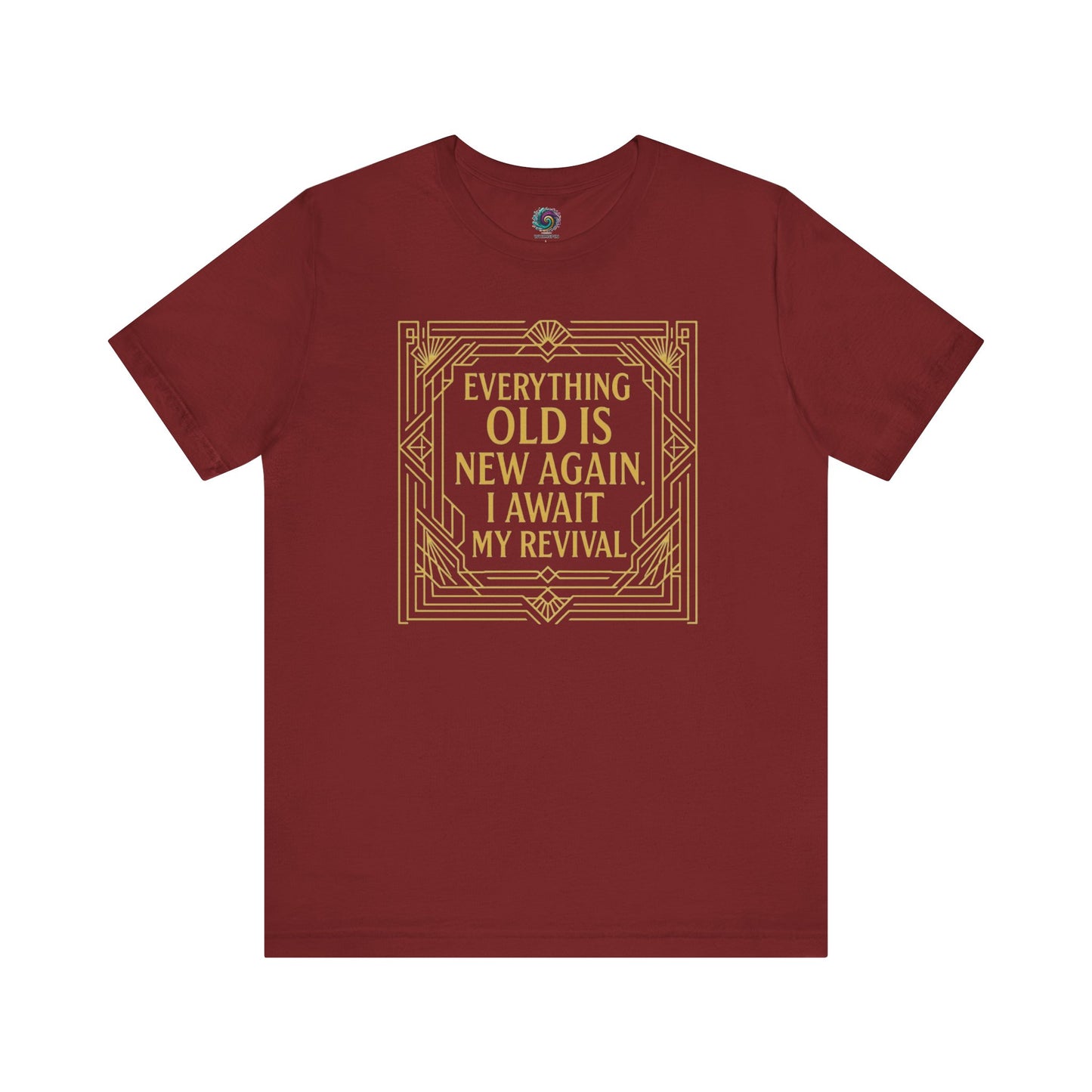Cardinal red shirt with Art Nouveau frame and humorous aging quote Everything Old Is New Again – I Await My Revival in gold typography.
