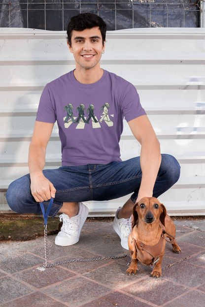 Cthulhu Crossing T-Shirt – Beatles Abbey Road Parody Tee in light purple, lifestyle shot with dachshund, Abbey Road parody t shirt with cute Cthulhu.