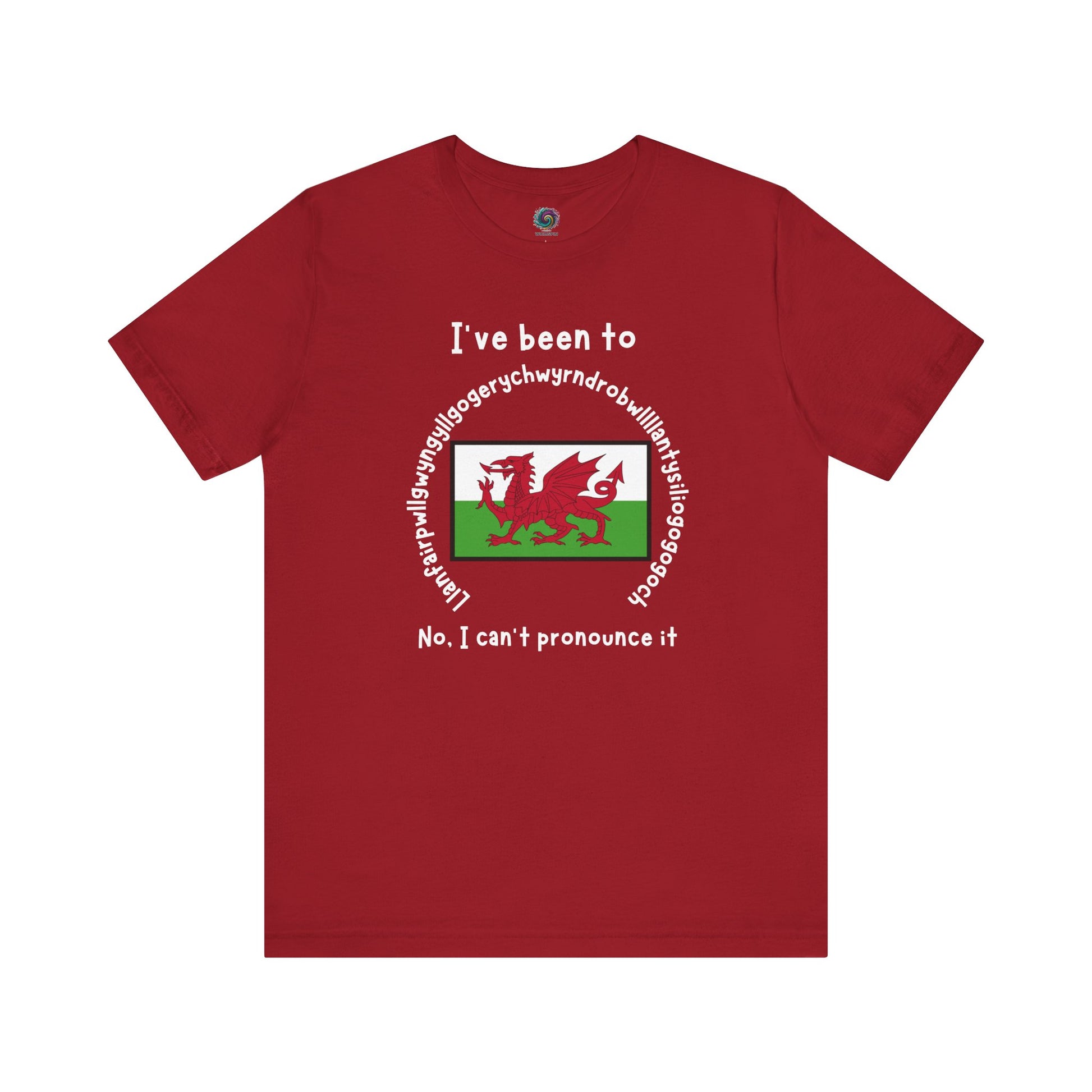 Llanfairpwllgwyngyllgogerychwyrndrobwllllantysiliogogogoch T-Shirt – Funny Wales Travel Merch in canvas red with bold white lettering and centered Welsh flag graphic.