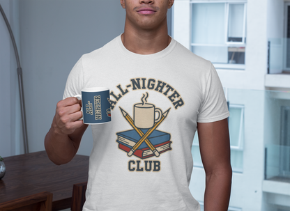 Lifestyle image of a man in an apartment holding the All-Nighter Club mug while wearing the coordinating white graphic tee, both featuring books, pencils, and coffee design.