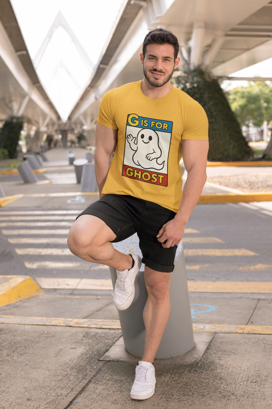 G is for Ghost T-Shirt – Funny Monster Alphabet Halloween Tee shown in gold, modeled outdoors, a playful ghost alphabet shirt with cartoon design.