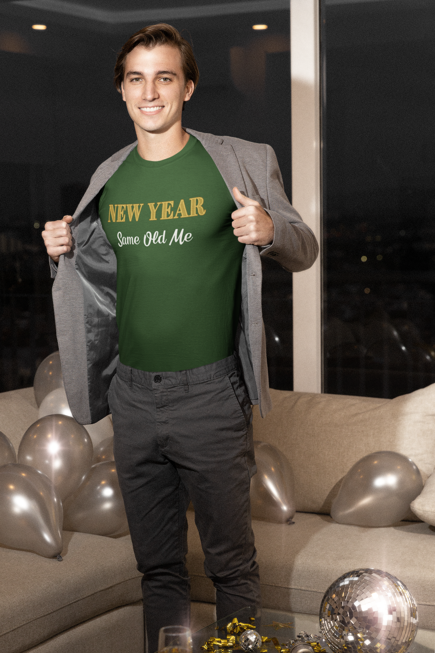 Image of a man wearing the New Year Same Old Me T-Shirt – Funny Self-Confidence Tee in green, posing confidently in a festive indoor New Year celebration setting.