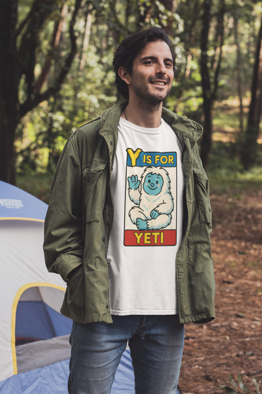 Y is for Yeti T-Shirt – Cute Winter Monster Tee from the Monster Alphabet Series worn by man at forest campsite, white color