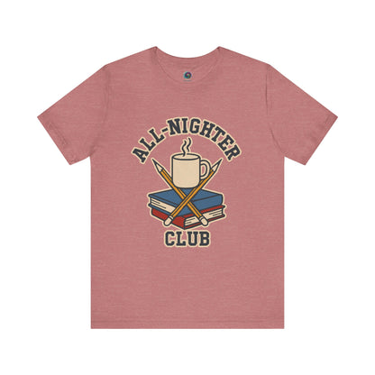 Mauve t-shirt with 'All-Nighter Club' graphic design featuring a mug, books, and crossed sticks on a white background. All-Nighter Club T-Shirt – Funny Caffeine & Study Tee for Night Owls