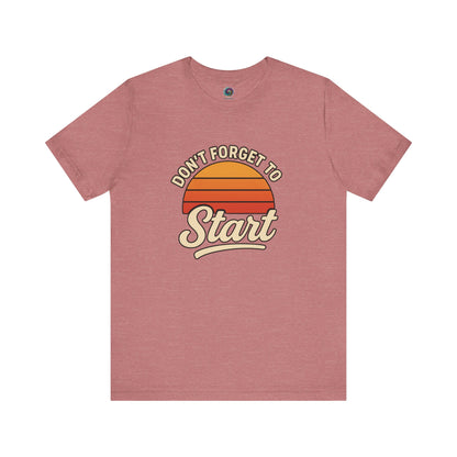 Don’t Forget to Start T-Shirt – Motivational Graphic Tee for Dreamers in Heather Mauve shown in flat lay with bold vintage design