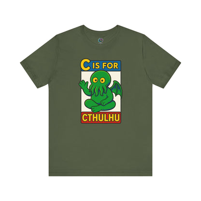 C is for Cthulhu T-Shirt – Lovecraftian Funny Cartoon Tee in military green, flat lay with whimsical Cthulhu cartoon design.