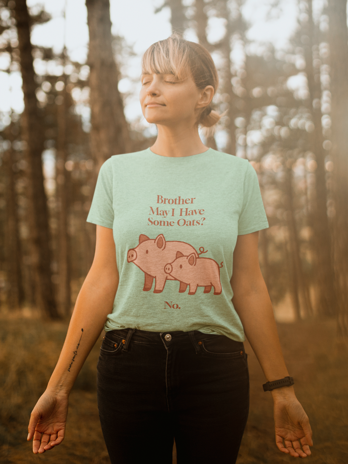 Brother May I Have Some Oats T-Shirt – Funny Viral Pig Meme Tee in mint, shown on a woman enjoying nature with a soft pastel pig oats meme design.