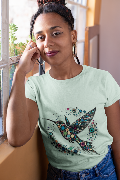 Hummingbird Dot Art T-Shirt – Colorful Nature-Inspired Graphic Tee worn by a smiling woman in soft green mint, showing close-up of intricate hummingbird dot art design on this hummingbird t shirt.