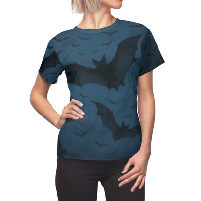 Side view of a woman modeling the Bats in the Sky Women’s AOP Shirt – Night Sky Bat All-Over Print, with scattered bats in a twilight sky covering the shirt.