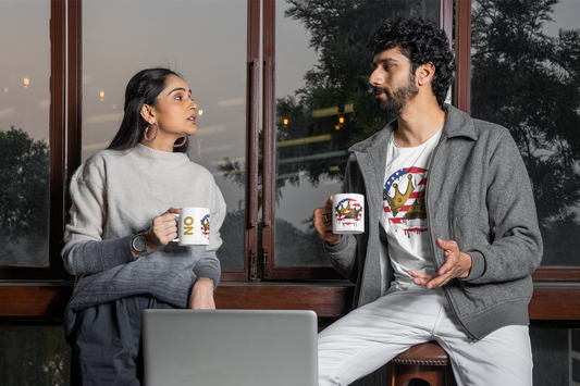 No Kings Mug – Anti-Monarchy Coffee Cup shown with a seated couple holding matching mugs and wearing “No Kings” shirts, emphasizing coordinated design and rebellious tone.