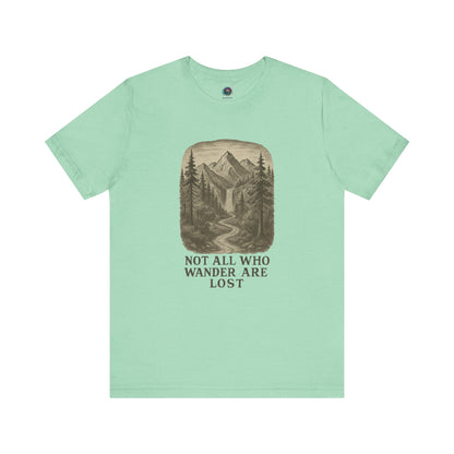 Heather mint “Not All Who Wander Are Lost T-Shirt – Tolkien Travel Tee for Nature Lovers” featuring scenic woodland trail graphic