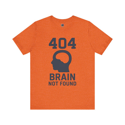 Orange "404 Brain Not Found T-Shirt" from WhimSpin. The tshirt graphic is a profile image of a human head with an empty hole where the brain should be and the text "404 Brain Not Found."