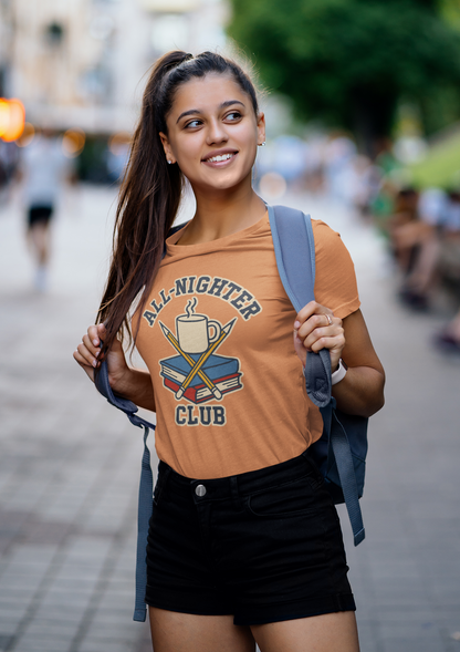 Woman wearing an  orangeAll-Nighter Club T-Shirt – Funny Caffeine & Study Tee for Night Owls shirt from WhimSpin with a backpack on a street.