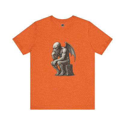 The Thinker Cthulhu Shirt – Lovecraftian Funny T-Shirt Unisex Graphic Tee in orange featuring a humorous take on The Thinker with a tentacled twist.