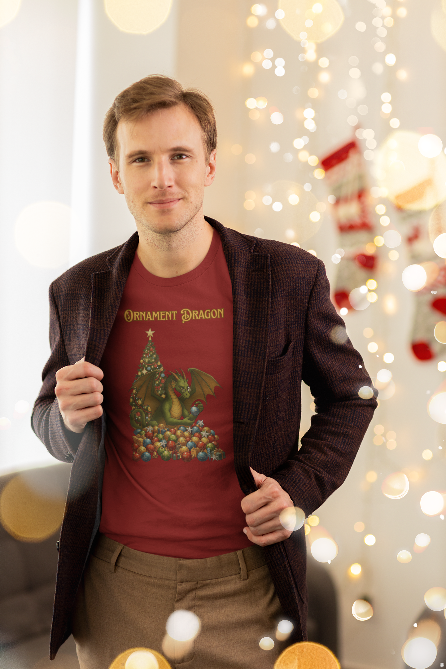 Ornament Dragon T-Shirt – Christmas Dragon Tee for Ornament Lovers, shown on man revealing shirt under blazer in festive Christmas light-lit room