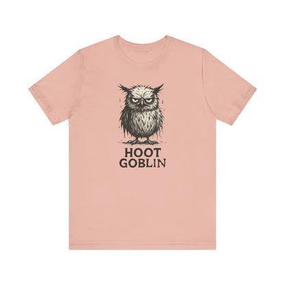 Peach t-shirt with an owl graphic and 'Hoot Goblin' text on a white background