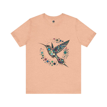 Hummingbird Dot Art T-Shirt – Colorful Nature-Inspired Graphic Tee in soft peach hue, featuring vibrant dot work of hummingbird for art and nature lovers.
